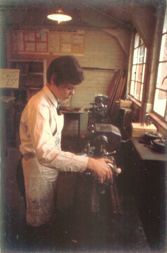 Chris Nelms operating one of the lathes in the metalwork shop, Farnham Garmmar School, early 1970s